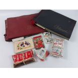 Two albums with postcards including eight WWI era silk greeting cards