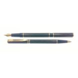 A WATERMAN France M stamped Fountain Pen and matching Roller Pen in black and brown livery - no