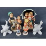 A collection of GOEBEL figurines to include a 1975 Leading the goat (334) 14x10cm, Young boy and