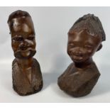 Two hand carved wooden busts from Africa.