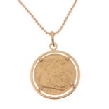 A 1915 George V sovereign set in 750 stamped yellow gold circular pendant suspended from a 750
