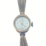 A LANCO circular ladies 375 stamped cased wrist watch with a yellow metal three strand twist