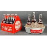 A quantity of COCA COLA advertising wares to include 6 coke bottles in a bottle rack and 3 bottles