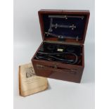 An EVERAY plasma electrotherapy kit in a walnut case with a handy booklet of instructions and