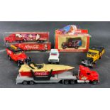 Seven COCA-COLA die-cast model vehicles to include 2 boxed Santa lorries, a boxed 1930 Model Ford