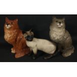 Three BESWICK CATS , the first a Siamese stands 17cm tall, the other two, grey and ginger are both