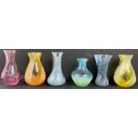 A collection of vibrant glass vases (quite possibly Caithness)