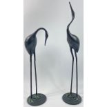 Two bronze CRANES one standing 53cm tall, the other 40cm