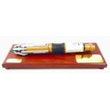 DOCTOR WHO -sonic screwdriver (2009) mounted on a wooden plinth with brass labels (25x5cm)