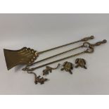 A selection of brass items to include a fireside shovel and large tongs 60cm approx, also includes