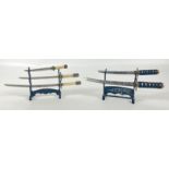 Two small decorative modern plastic stands with model Samurai swords