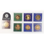 A selection of cased commemorative medallions / coins to include: Lindisfarne Castle, City of