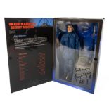 SIGNED JAMES BOND - autographed by GEORGE LAZENBY, a Sideshow Toy 12" figure of George Lazenby in