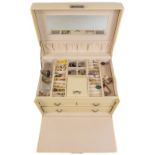 A cream leather style jewellery box with 3 drawers and inside mirror, containing a lots of pairs