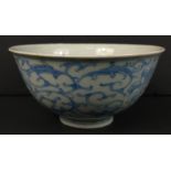 A small Chinese bowl (11cm dia) with a scrolled floral design, with marking to base, a few minor