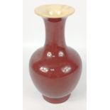 A vintage Chinese sang de beouf vase with crazing to the inside and base glaze standing 20cm tall