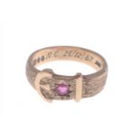 375 stamped yellow gold belt-buckle ring with a small diamond-shaped garnet - gross weight 3.58g