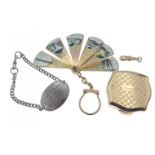 A small box to include a STRATTON yellow metal pill box, a tourist style fan key-ring, a white