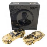 CORGI & BOND 40th Anniversary twin set of gold Aston Martin model cars a DB5 and a V12 Vanquish in