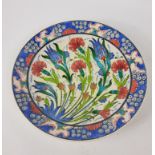 A bright and colourful hand-made charger with floral design, comes from Turkey 31cm diameter approx