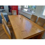 A substantial light Oak dining table by ROYAL OAK and six matching oak dining chairs in striped