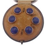 A boxed set of EDWARDIAN six yellow metal blue agate shirt studs (2 fasteners missing and 1 stud