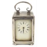 A miniature boudoir French movement solid silver carriage clock