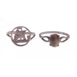 Two silver rings, one with a Viking ship design, the other with a brownish coloured centre stone -