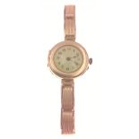 A lady's yellow gold watch with a stamped 375 case (2.75cm dia) and English made 9ct bracelet,