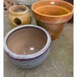 Three garden planters to include a large terracotta pot dimensions 30cm height x 37cm diameter and