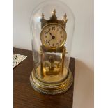 A nice glass domed brass clock