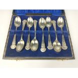 A set of eight RIFLE CLUB silver teaspoons all within a jewellers presentation case weight 112g
