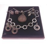 An OLA GORIE box containing white metal pendant and chain, a Swarovski set of matching pendant,