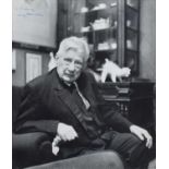 L.S. Lowry R.A. (British 1887-1976) at his home in Mottram, signed photograph.