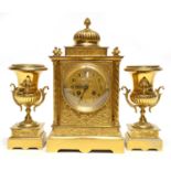 Victorian gilded clock garniture, with key and pendulum