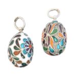 Two silver enamel egg pendants,