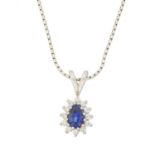 An 18ct gold synthetic sapphire and diamond pendant,