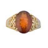 A hessonite garnet and diamond dress ring,