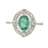 An emerald and diamond cluster ring,