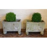 Two reconstructed stone garden troughs