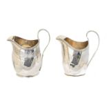 A silver milk jug,