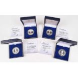 Assortment of seven cased London Mint Office sterling silver commemorative coins (7).