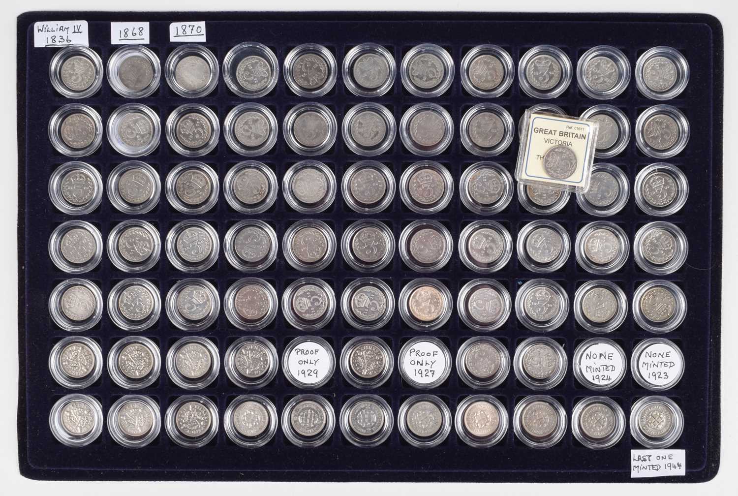Tray of silver and later Threepences from William IV through to George VI (74).