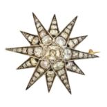 A diamond star brooch,