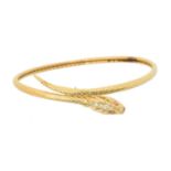 An 18ct gold snake bangle,