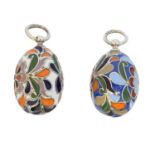 Two silver enamel egg pendants,