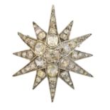 A diamond star brooch,