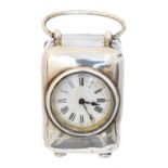 An Edward VII silver cased miniature travel clock,