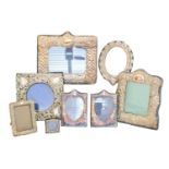 A selection of silver and white metal fronted frames,