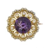 An early 20th century amethyst and split pearl brooch,